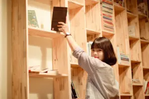 girl getting a book