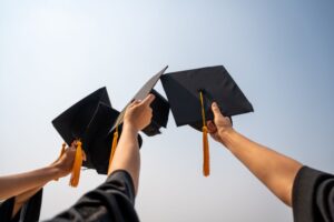 raising graduation cap