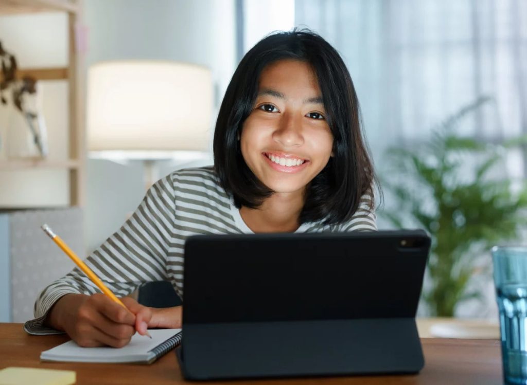 a student in front of a tablet studying