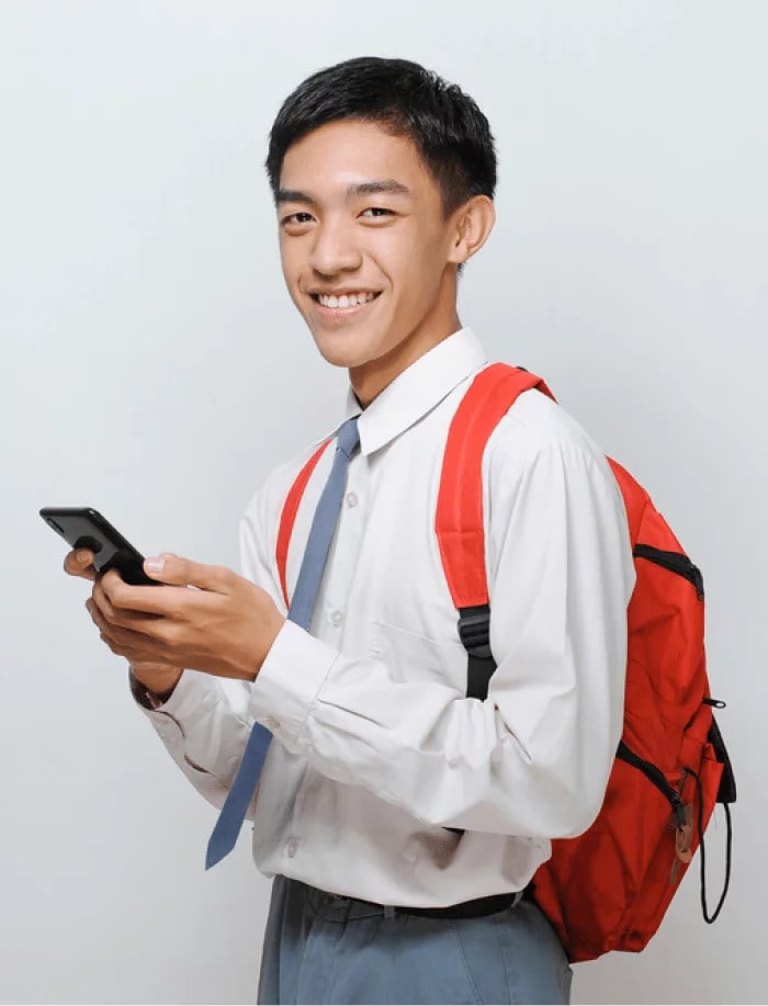 a student wearing a backpack holding a phone